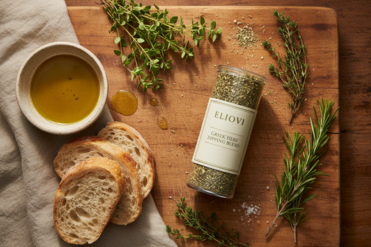 Eliovi Eliovi herb blend container styled as a premium Mediterranean flat lay with fresh herbs, olive oil dipping bowl, artisan bread