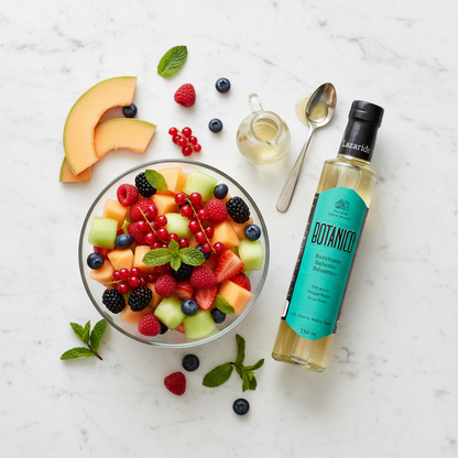 Botanico White Balsamic vinegar with colorful fruit salad
