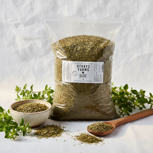 Shopify (3:2): Othrys Wild Greek Oregano 1 lb bag flat lay with dried oregano, ceramic dish, and fresh branches on rustic wooden spoon

