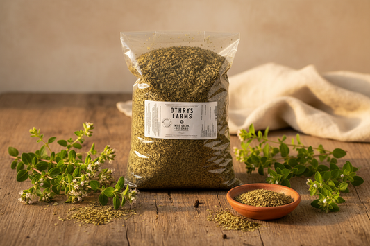 Shopify (3:2): Othrys Wild Greek Oregano 1 lb bag flat lay with dried oregano, ceramic dish, and fresh branches on rustic wooden surface
